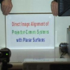 Direct Image Alignment of Projector-Camera Systems with Planar Surfaces